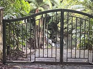 YB water reference through gate on road.jpg